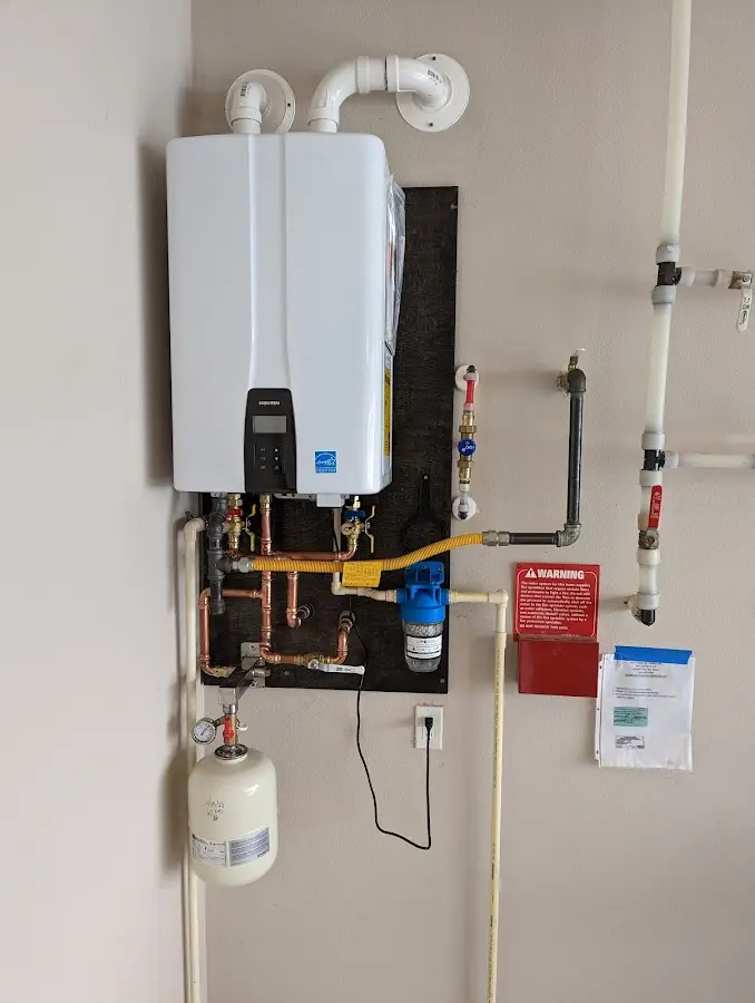 Professional plumber installing copper piping in a Mountain Home home